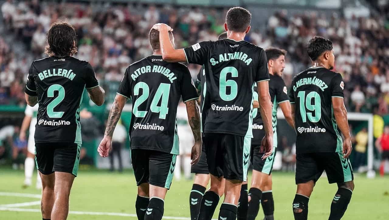 Betis celebrate their goal in the first half.